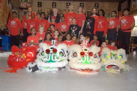 Adults and children group picture.