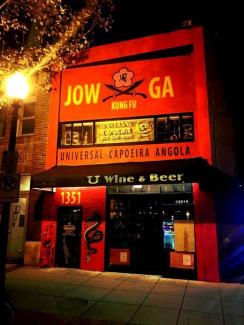 our building on U Street, painted red, illuminated by a street lamp.