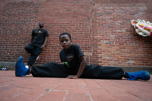 Streching student prepares for performance [pic: Miki Jourdan].